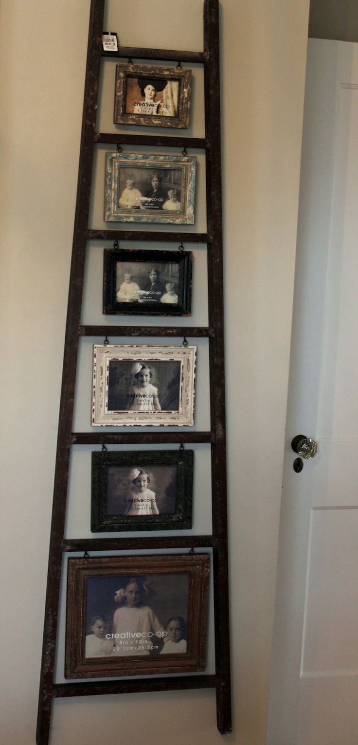 Ladder picture display- Just hang hooks under each step and attach 