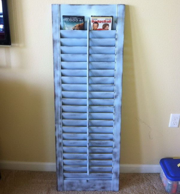 This old shutter was painted and repurposed to be a DVD holder. source
