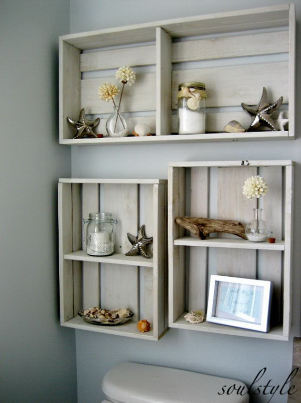 Hang some DIY crates on the area over the toilet to add some decor. The dried beach dahlias in tiny bubble vases, mason jars filled with candles & bath salts, some driftwood, and a few starfish & shells make your bathroom super fantastic. 