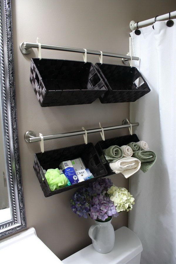 Hang these baskets over the toilet to store toiletries, wash cloths or hand towels and they look good doing it. 