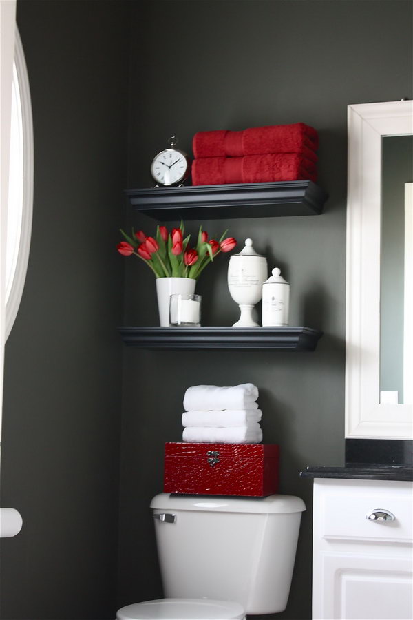 Floating shelves were installed over the toilet for additional storage. Filled with bathroom necessities and a few pretty things, it doubles as a welcoming display. 