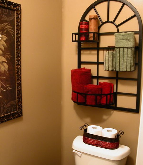 What a great idea with this pot rack over the toilet for storage and display. 