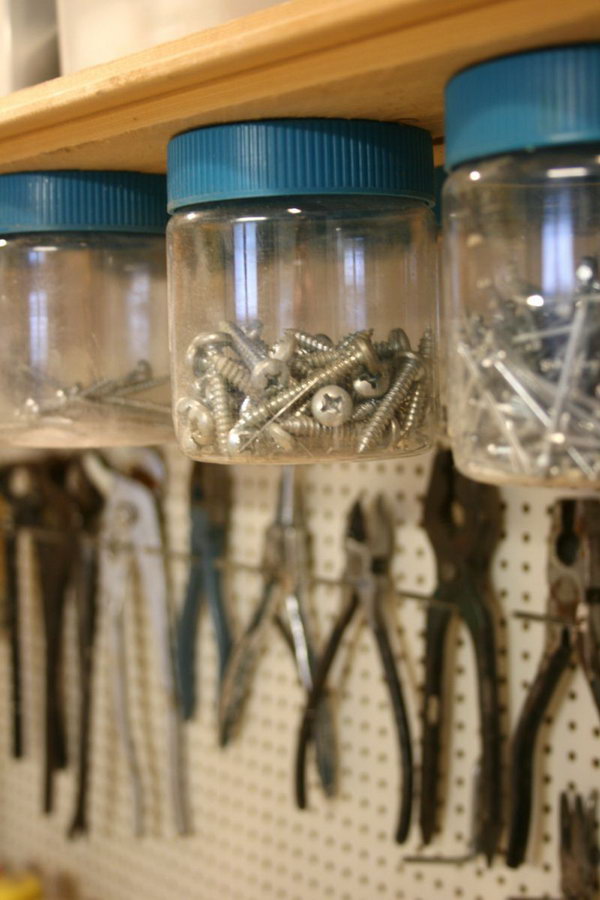 Hang Jars Under Shelves. Screw the jar lids into the wooden shelf that sits above the work top, and then screw the jar onto the mounted lid. Keep nails, screws and other small items out of the way and pretty organized. 