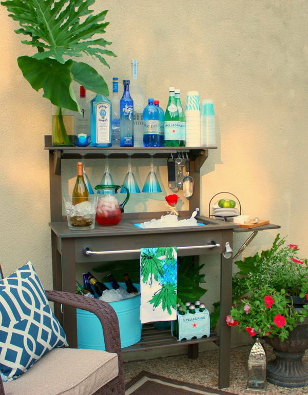 Potting Bench Drink Station. Display turquoise accessories to give this charming potting bench turned outdoor bar a summertime design. Drinks you serve on the terrace should be kept in a tight color scheme to create a harmonious visual effect. 