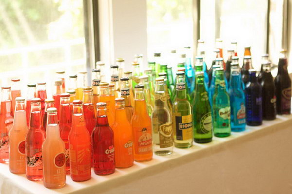 Classy Soda Bottle Drink Station. I really adore this beautiful and funny layout with a selection of soda bottles in bright colors. It's perfect to serve it to satisfy the taste of all ages. 