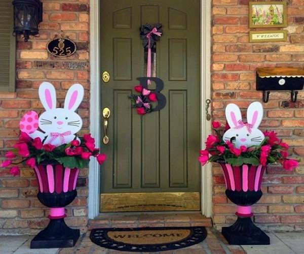 Easter Bunny Decoration. The cute Easter bunny in the decorated flowerbed makes this decoration style live and funny. The left one holds the Easter egg while the other one tries to hide in the flowerbed. 