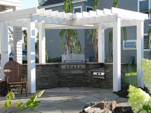 This outdoor kitchen takes its colors from the earth and the sky. It is about being friendly with nature. Looking simple but equipped with everything you need for cooking. It's fully functional. 