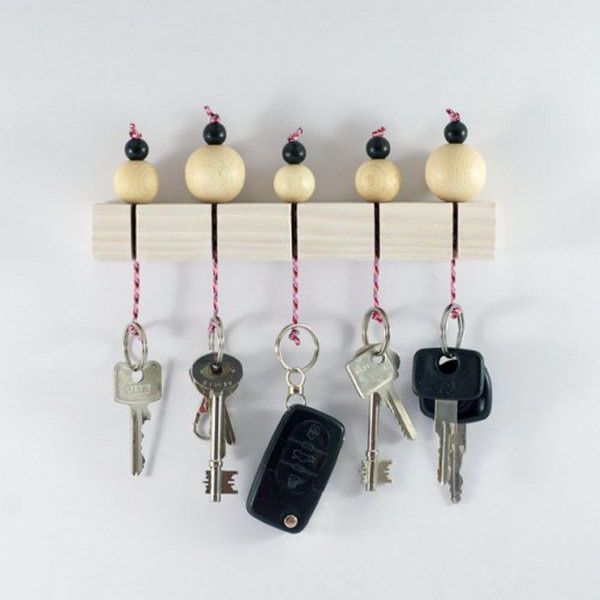 DIY Key Holder With Wooden Beads. Keys are always laying around, so having one central location with a little extra cuteness is a win win! Check out and create one super cute wooden beads key holder like this for your own 