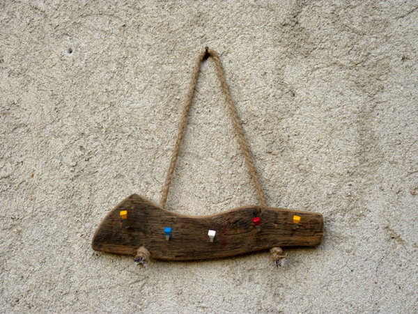 Wall Hanging Wood Key Holder. This key holder idea needs very little effort to complete. Just attach some colorful hooks to a piece of old solid wood ,then hang it on the wall with rope and you've got yourself a beautiful and functional key holder. See more 