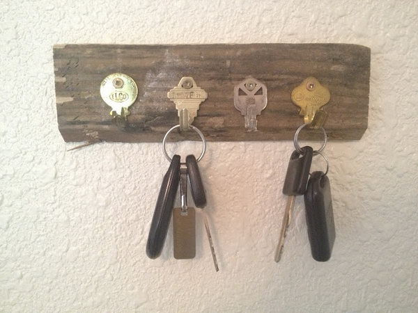 DIY Key Holder Using Old Keys. Here is another opinion regarding DIY key holders. Get old and unwanted keys bent and secured them on a rectangle piece of wood. A functional and cheap key holder is here for you. See how to do it 