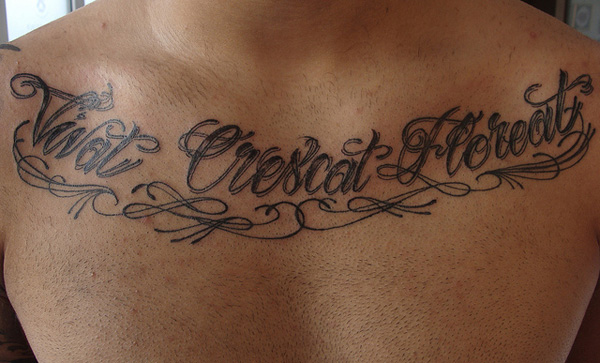 cursive-text-tattoo-on-chest-34