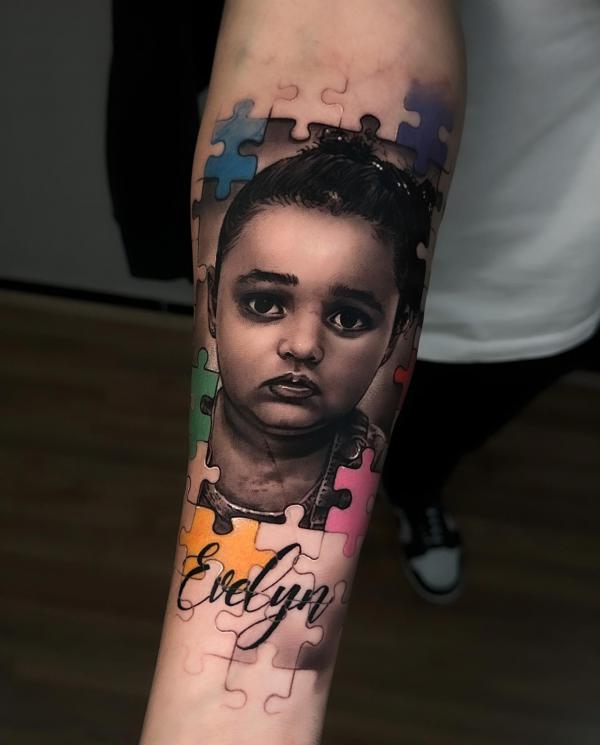 Boy and puzzle tattoo