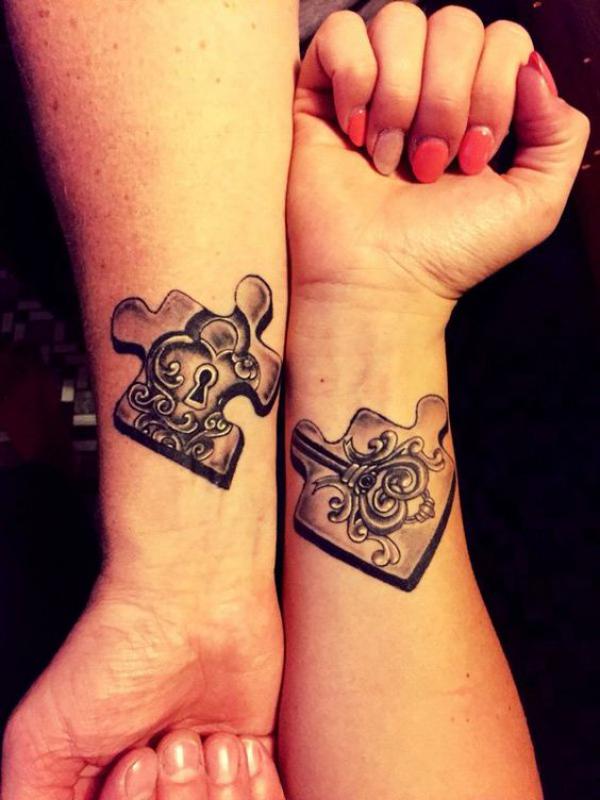 Lock and key puzzle couple wrist tattoo