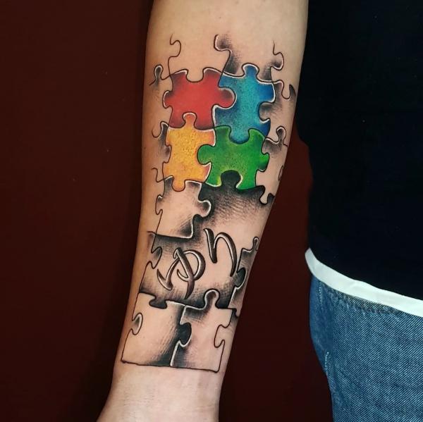 Puzzle forearm tattoo