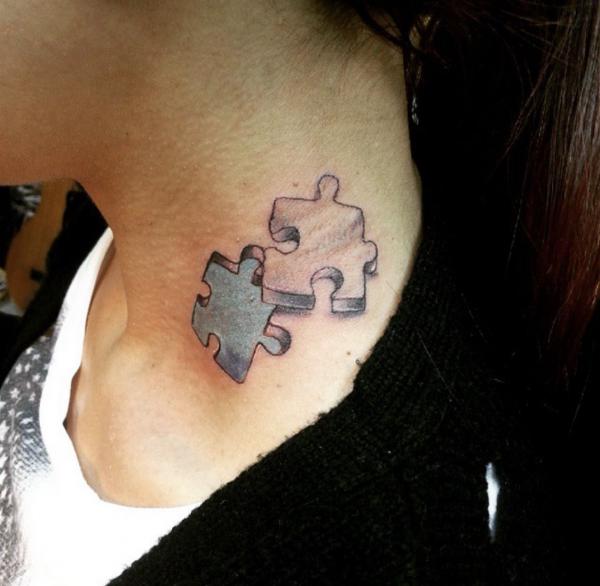 Puzzle neck tattoo