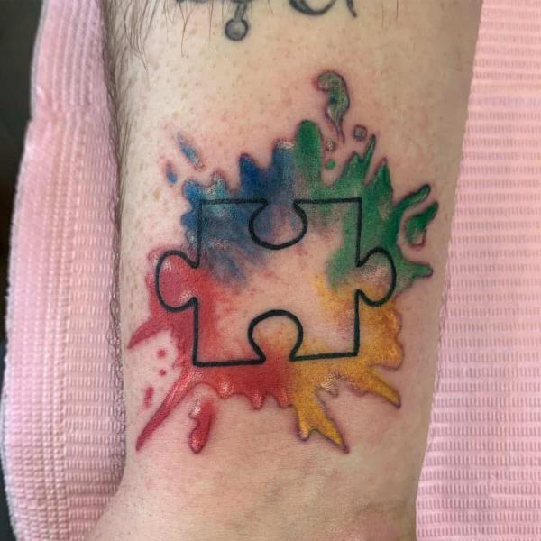 Small Autism puzzle piece tattoo