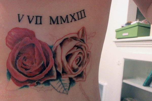 Tattoo uploaded by James Lightyear  Neo traditional roses added as a  border around existing roman numerals  Tattoodo
