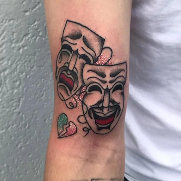 Colored smile now cry later with broken heart tattoo