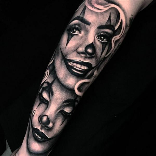 Smil clown and Cry face forearm tattoo