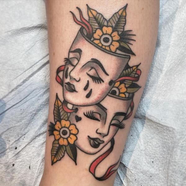 Traditional Smile now cry later with flower tattoo