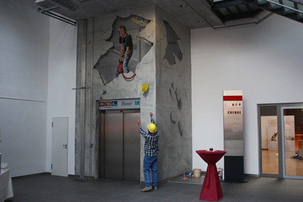 3D Street Art Treuhaus - Frankfurt. A real estate company was celebrating 25th anniversary of their object. The 3D artist worked on concrete in the atrium.