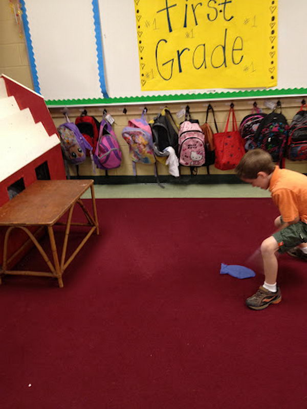 Go Fishing as a 15 Minute to Win It Party Game. Fan the tissue paper fish under the little brown table(fish trap).