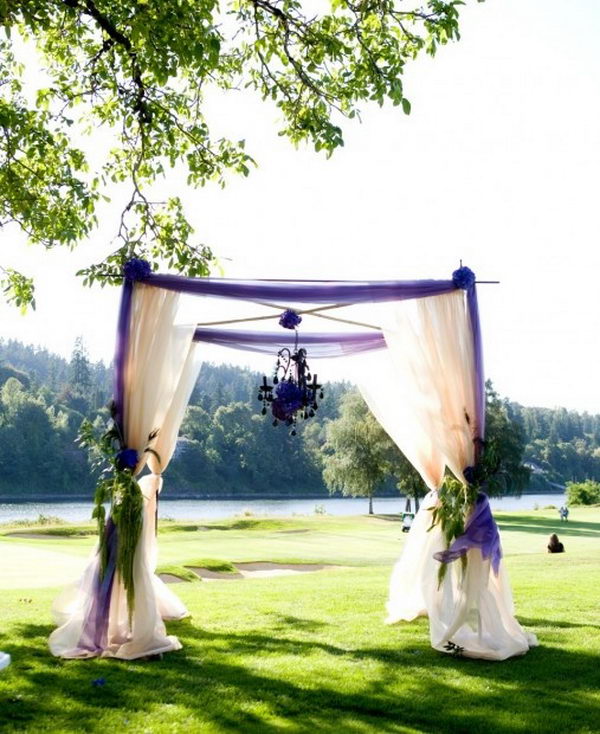 Purple Chuppah With Hanging Chandlier.