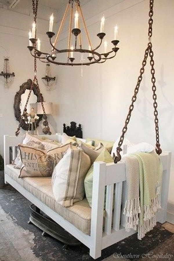 Repurposed crib into porch swing.