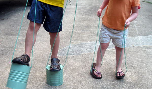 Tin can stilts. Tin cans are not just for stacking up in your cabinet, tossing in the trash or sending to the recycle bin. Combine those with a rope, paints, craft papers and a generous helping of crazy imagination, and you will have a cool creation on your hands.