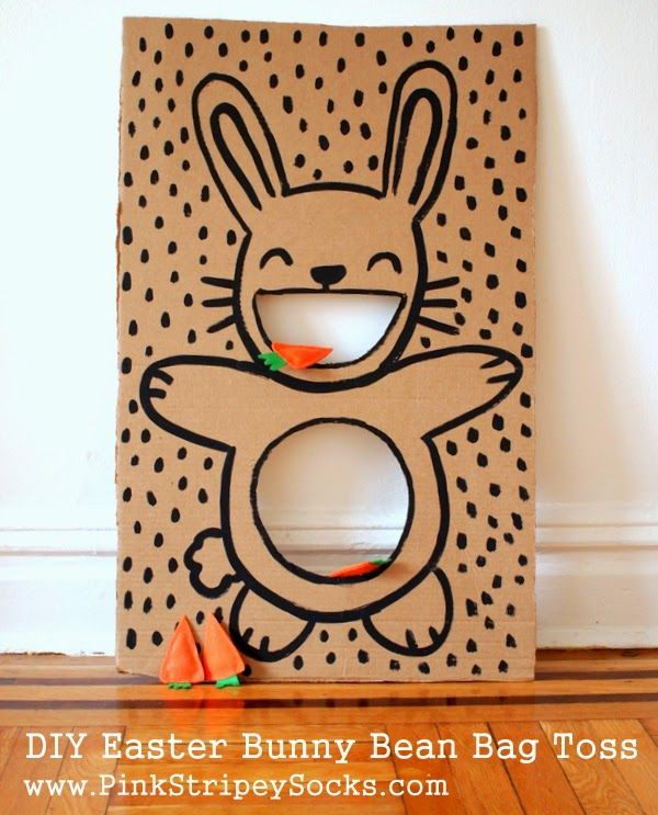 DIY Easter Bunny Bean Bag Toss. Set up a simple cardboard Easter bunny bean bag toss game with carrot bean bags. Kids will have fun playing this in party.