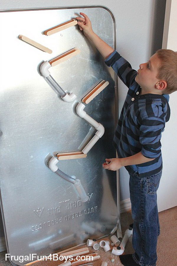 Marble Run Made from PVC Pipes and Craft Sticks. It’s easy to make quick adjustments to the slope of the pieces so that the marble goes exactly where you want it to go. Kids would have so much fun playing this game. 