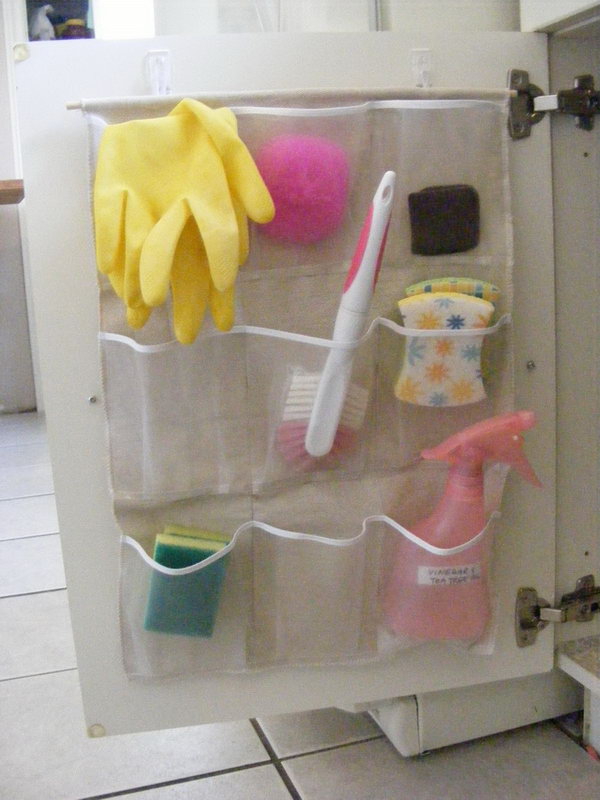 Cut one large shoe organizer in half and use on each side of the under sink cabinet. It's a perfect solution to hold sponges, scrub brushes and other cleaning items. 