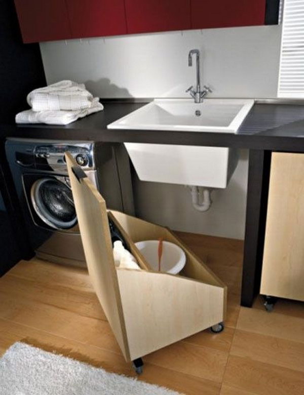 This DIY pallet wood storage bin with wheels provides movable storage under the sink. 