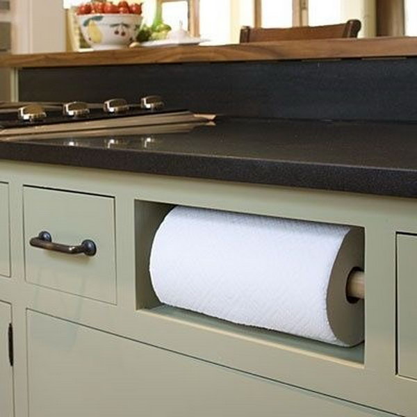 Remove your fake drawer in sink cabinet and turn it into a paper towel holder. 