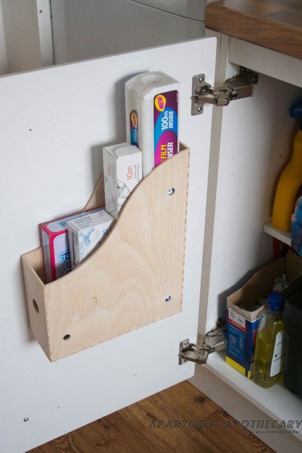 Use Ikea Knuff magazine files as under sink storage holders. Screw a magazine file holder to the inside of kitchen cupboards. Add space to store more bulky items like chopping boards, cleaning products etc. 