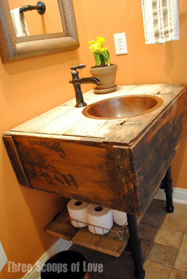 Toilet Paper Storage Under Sink. Put a wooden board under the vanity to store the toilet paper rolls. The vanity made from a salvaged wall cabinet and the board under sink add a vintage touch to your bathroom. 