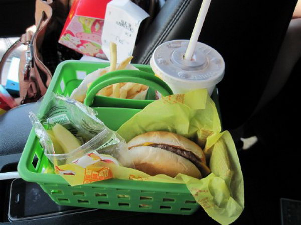 You can buy a cheap basket as a food holder in the car for your kids to keep food from getting spilled all over your car. Besides, this organizer has three compartments so everything has a place for your convenience. 