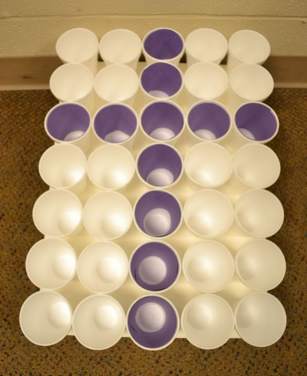 Cross Toss. Prepare all the cups in a tray and insert the rolled purple paper to make a cross. Throw all the purple Easter eggs in the purple cups. The kids will surely have fun and they can also improve their shooting accuracy.