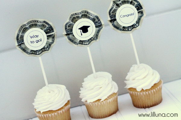 Cash Topped Graduation Cupcake. Fold cash bills into accordions, Glue them on the Popsicle sticks and use glue spot to add those labels. It's time to surprise the graduate with this cash topped graduation cupcake for sweet flavor and emergency need of cash.