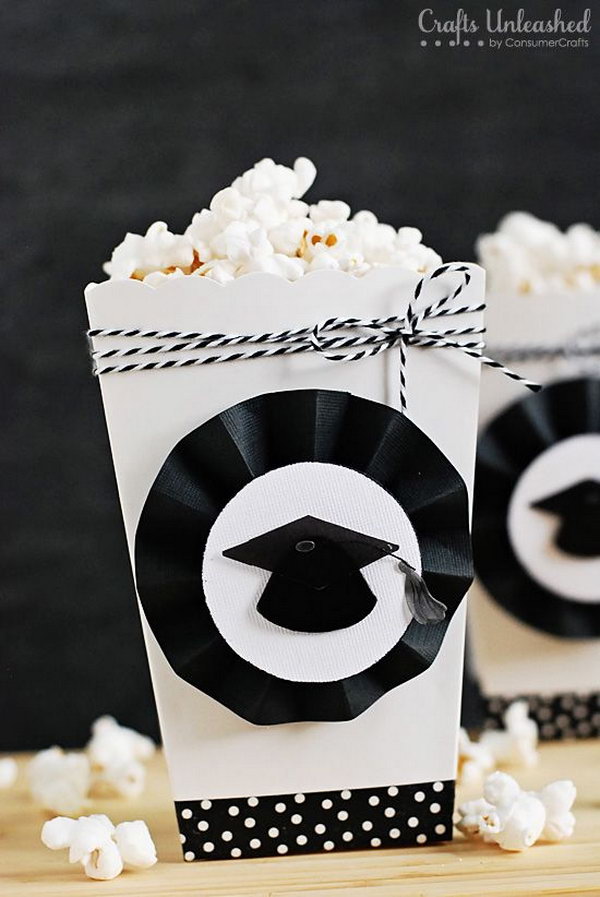 Graduation Party Popcorn Boxes. Embellish the white boxes to coordinate with your party theme. Make the rosettes with a scoring board and black cardstock to finish off the popcorn boxes with a graduation party design.