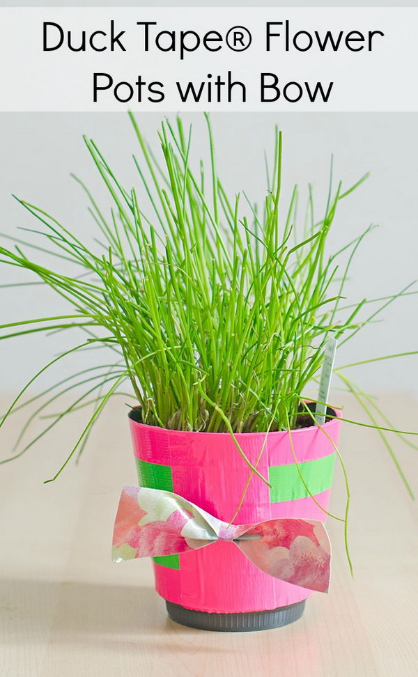 Duck Tape Flower Pots with Bow. What a great way to dress up the standard pot plants. This would make for a great DIY Mother’s Day gift idea.