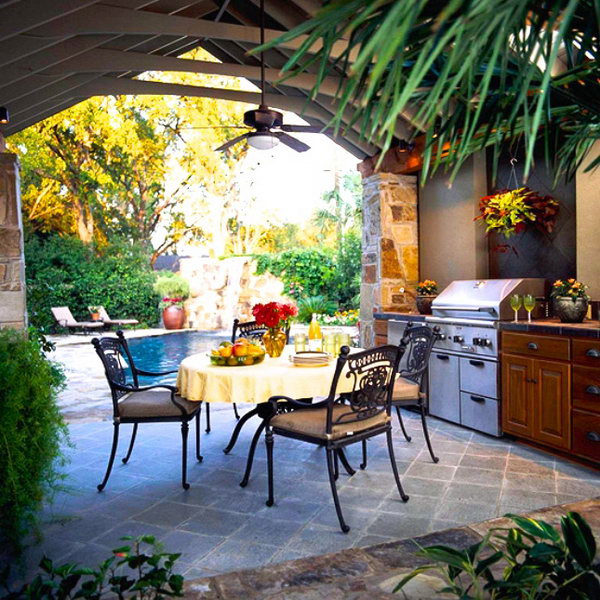 Outdoor dining room. A poolside dining space with a ceiling fan gets the air moving, keeps the kitchen cool and ensures the outdoor party continues all day long.