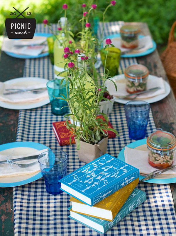 Vintage Summer Party Table Setting. Cover the plastic base with craft paper, display canning jars and floral plants to add up its color and strike the right balance between pretty, special and unfussy.