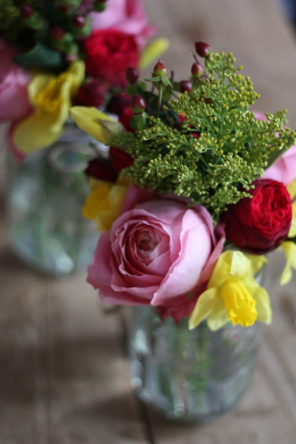 Hanging Mason Jar Flower Vases. If your wedding ceremony happens to be an outdoor garden setting, try to bring in more colors and personalized design with this hanging mason jars with frog lids to hold flowers. All you need is metal hardware cloth, coiled wire, wire cutters, permanent marker, and medium for hanging jars as well as scrap paper or drop cloth for protection.