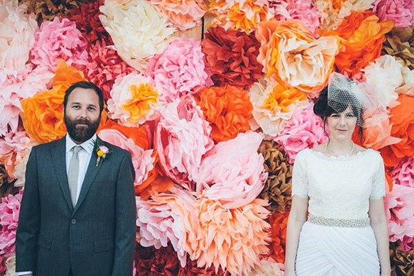 Floral Backdrop. In order to treasure your sweet memories of your wedding day, take a photography with this beautiful floral backdrop in bright colors.