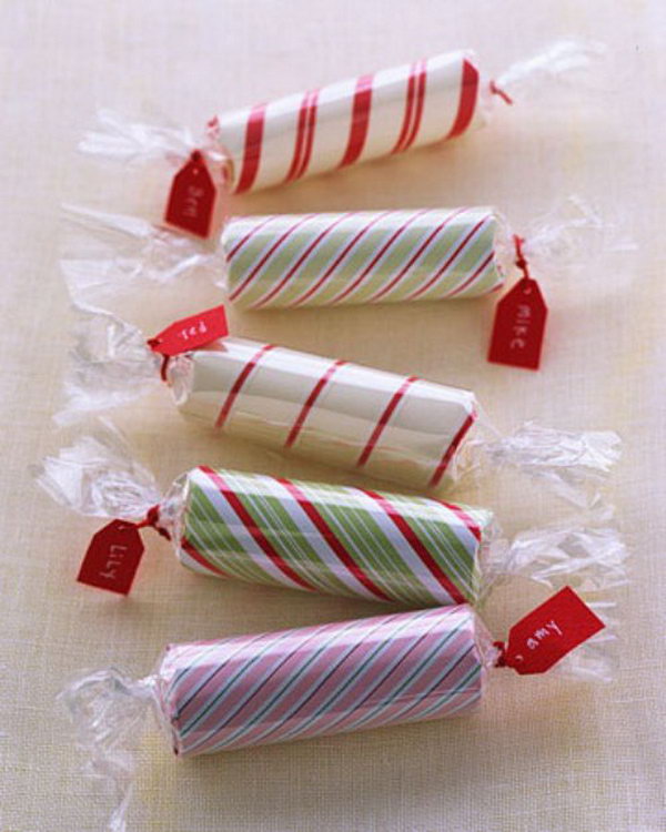 Candy Coins. It's inconvenient to take your pile of coins. Wrap roll of coins with wrapping paper in rectangle shape and attach quilling strip with tapes. Add cellophane, twist ends and attach tags with yarn to pack the coins in this super chic way with little costs.