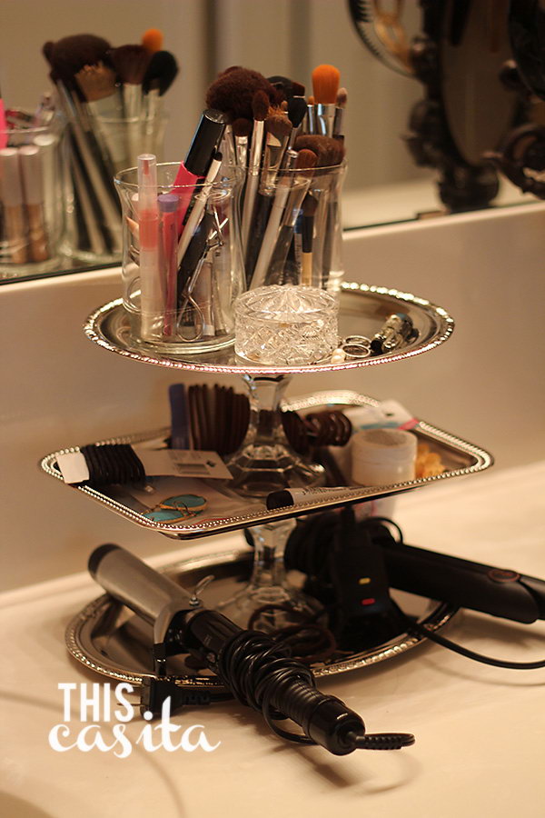 Dollar Tree Makeup Storage. Makeup storage can be costly. This dollar tree makeup storage will be your favorite. What you need is faux silver trays in each size and a couple of candlesticks to make this one. Get tutorials here.