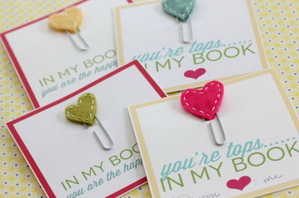 Adorable Stitched Heart Bookmarks. Use paperclips, white embroidery thread and colorful fabric to make these adorable stitched-heart bookmarks as perfect gifts to all the book lovers in your life. See the details here.