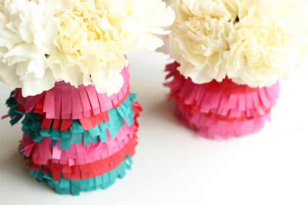 May Bouquet. Wrap cut pieces of tissue paper around the jar, add the tape to make great stripes, fill with water and flowers to create this simple yet elegant bouquet out of carnations to make a beautiful decor.