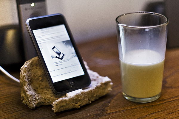 Bread Shape iPhone Dock. As its name suggests, this iPhone dock features its cool outlook, this docking station looks like a slice of bread with a bite taken out of it. It's super chic to display your device with this cool design.